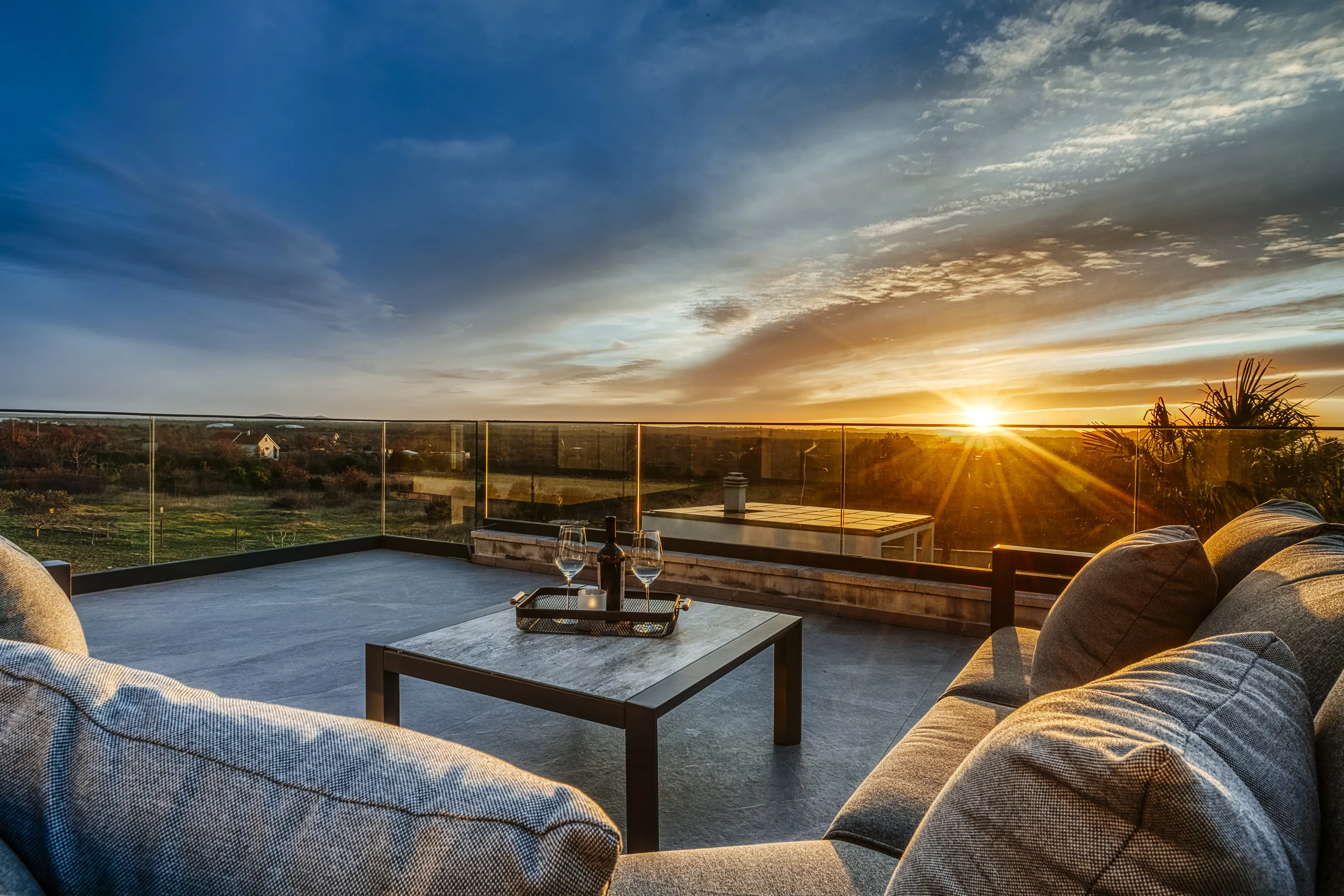 Outdoor terrace at Villa Stressless at sunset